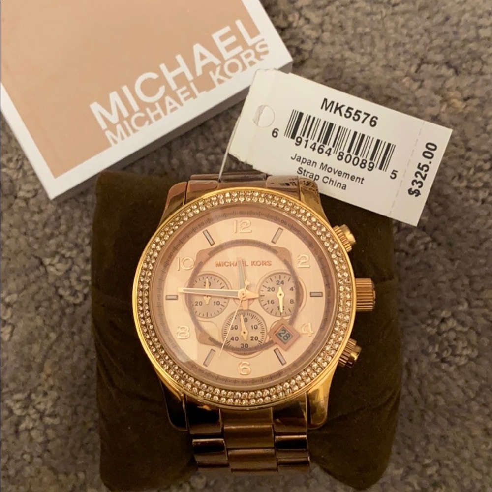 MK rose gold woman’s watch with rhinestone frame